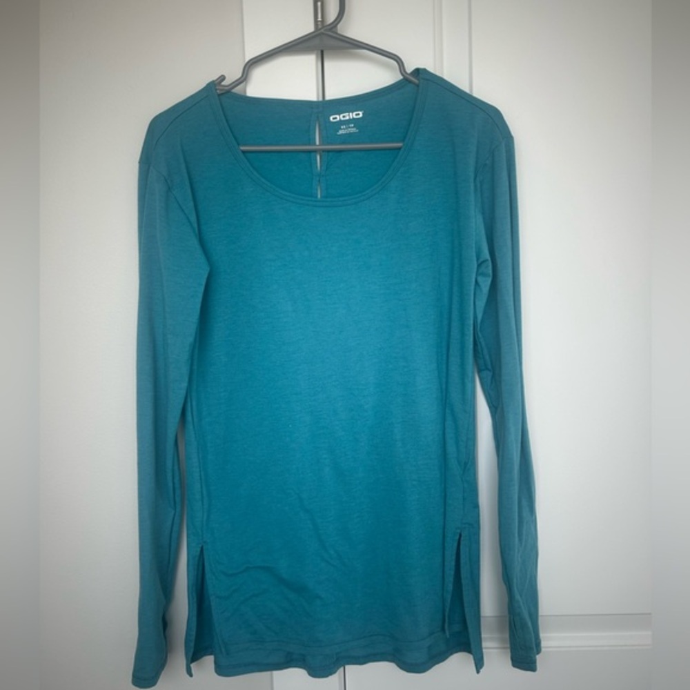NWOT OGIO teal long sleeve top with cut out on back